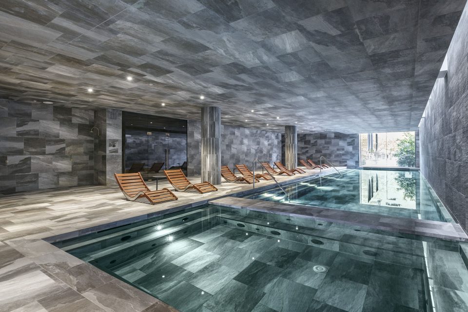 Indoor pool with poolside seats