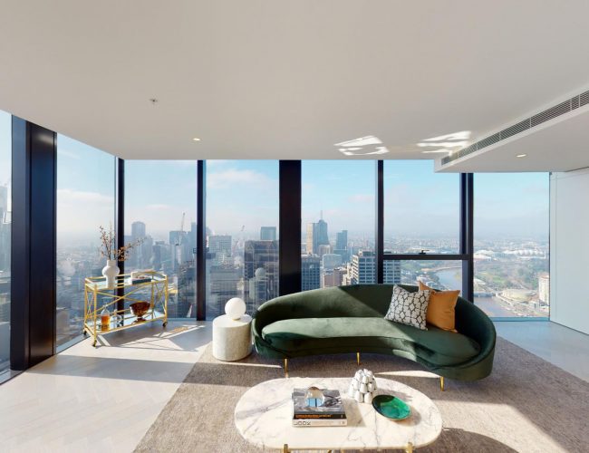 Living area with expansive windows and city views